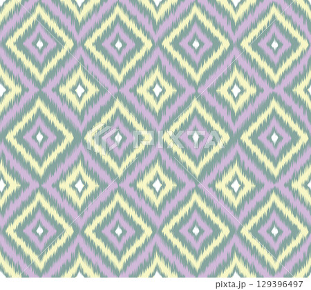 Seamless pattern with diagonal geometric line ornament in artistic boho style. Traditional ikat fabric Rough Chevron Decorative Background 129396497