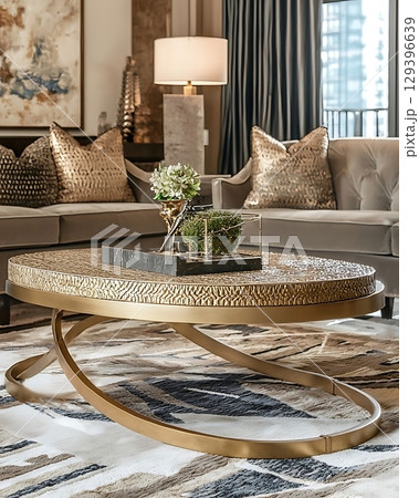 Living room with a gold coffee table and a couch Living room with a gold coffee table and a couch 129396639