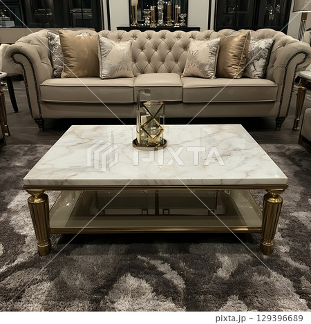 Living room with a white couch and a white coffee table 129396689