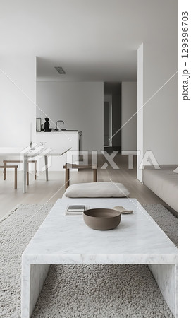 White living room with a white coffee table and a white couch White living room with a white coffee table and a white couch 129396703