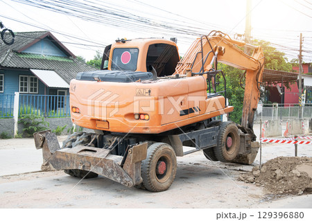 Large trucks are working on the job site. Large trucks are working on the job site. 129396880