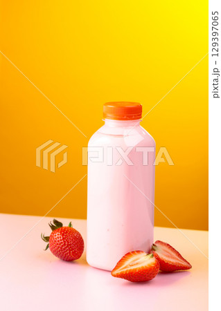 Strawberry milkshake smoothie in eco disposable jar and fresh berries. 129397065