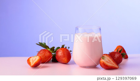 Strawberry yogurt and fresh berries on a colorful background. 129397069