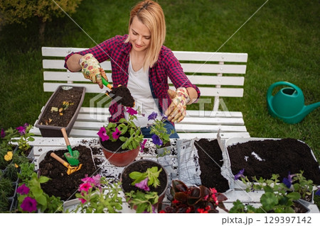 Creating a vibrant garden oasis in the backyard 129397142