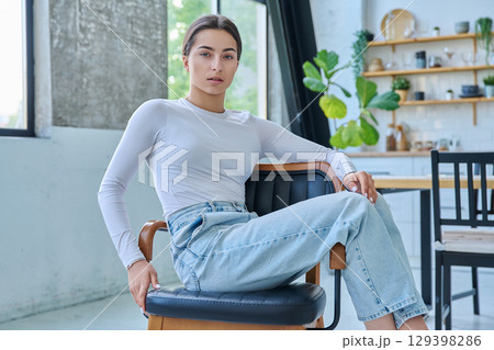 Portrait of beautiful stylish young teenage girl posing at home Portrait of beautiful stylish young teenage girl posing at home 129398286