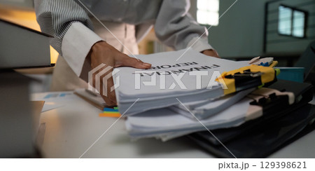 Organizing financial records in a modern office setting Organizing financial records in a modern office setting 129398621