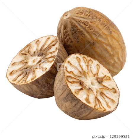 Whole and halved fresh nutmeg with seed visible, aromatic spice isolated on transparent background 129399521