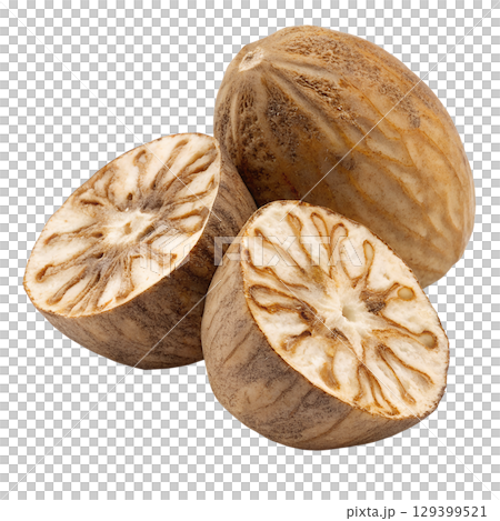 Whole and halved fresh nutmeg with seed visible, aromatic spice isolated on transparent background 129399521