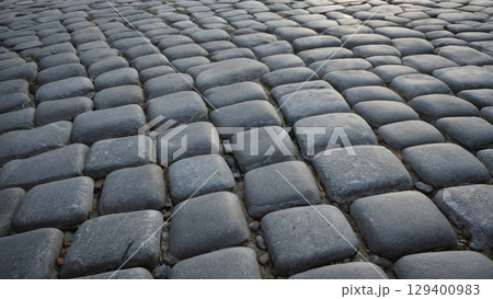 A closeup view of impressive cobblestone pavement illuminated beautifully in natural light 129400983