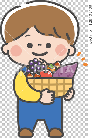 秋の味覚がいっぱい入ったかごを持つ男の子 129401409