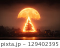 Majestic Tree Illuminated by Bright Full Moon Over Serene Night Landscape 129402395