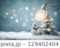 Charming Winter Scene with Snowman and Christmas Tree Illuminated by Vintage Light Bulb 129402404