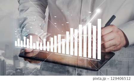 Business professional analyzing financial data on digital tablet with graphic charts and city background showcasing market growth and analysis trends Copula Business professional analyzing financial data on digital tablet with graphic charts and city background showcasing market growth and analysis trends Copula 129406512