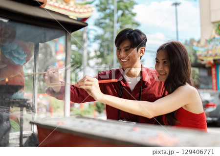 Joyful Travel During Chinese New Year Celebrations with Traditional Customs and Festive Atmosphere Joyful Travel During Chinese New Year Celebrations with Traditional Customs and Festive Atmosphere 129406771