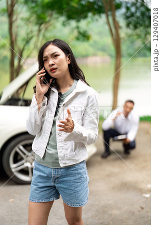 Insurance Claim. Frustrated woman on phone discussing vehicle issues with an agent. Insurance Claim. Frustrated woman on phone discussing vehicle issues with an agent. 129407018