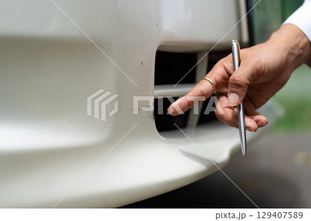 Insurance Inspection. Close-up of vehicle damage assessment. Insurance Inspection. Close-up of vehicle damage assessment. 129407589
