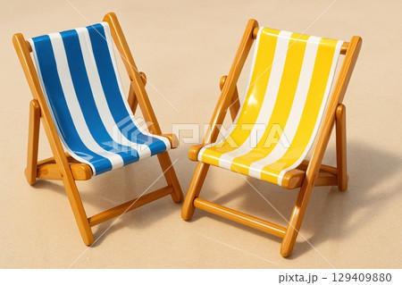 Two classic wooden beach chairs with blue and yellow stripes for summer vacation 129409880