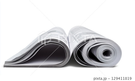 rolled up magazine pages on white background 129411819