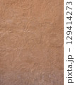 Smooth, textured wall surface in warm beige tones, ideal for backgrounds or design elements. subtle variations add depth and character to any project 129414273
