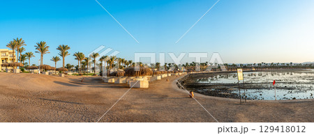 Golden Sunset Over Marsa Alam Resort with Palm Trees Golden Sunset Over Marsa Alam Resort with Palm Trees 129418012