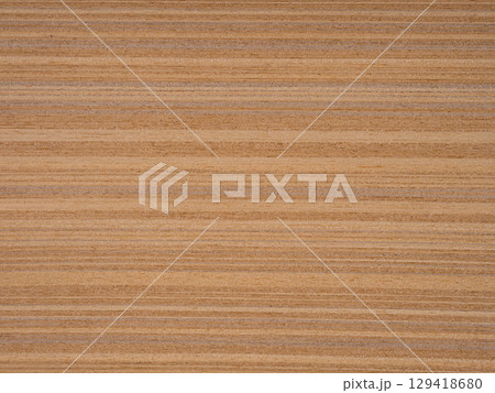 Striped teak veneer exudes a natural warmth with its golden-brown stripes over a canvas of honey and amber 129418680