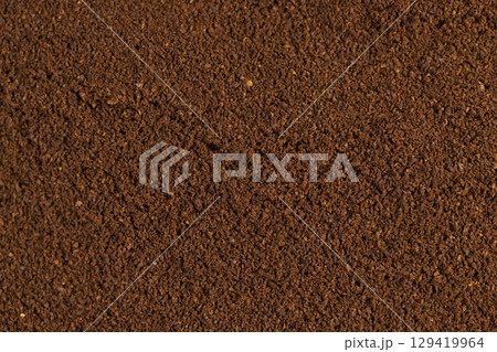 a large number of ground coffee beans for quick preparation of a drink, roasted ground coffee in large quantities a large number of ground coffee beans for quick preparation of a drink, roasted ground coffee in large quantities 129419964
