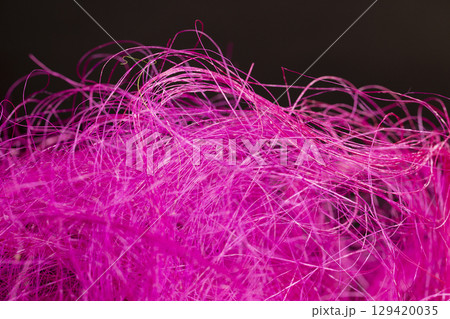 threads dyed pink for decorative work and creative work of artisans, closeup 129420035