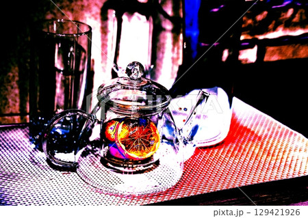 lemon in a glass teapot on the kitchen table. Winter holidays concept. 129421926