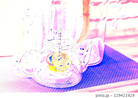 lemon in a glass teapot on the kitchen table. Winter holidays concept. 129421929