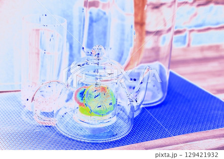 lemon in a glass teapot on the kitchen table. Winter holidays concept. lemon in a glass teapot on the kitchen table. Winter holidays concept. 129421932