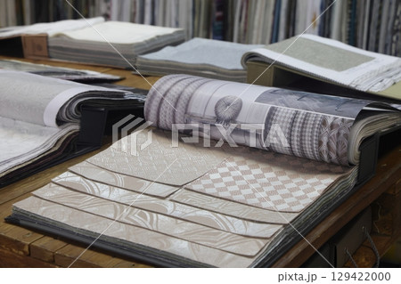 Many different colorful fabric samples as background, closeup. 129422000