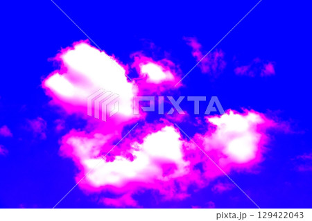 Beautiful patterns of clouds on a clear sky background. Changed color scheme. Colorful background. Beautiful patterns of clouds on a clear sky background. Changed color scheme. Colorful background. 129422043