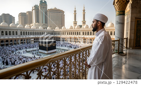 Muslim Pilgrim Overlooks Sacred Kaaba During Hajj in Mecca 129422478