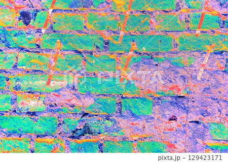 Peeling paint on a brick wall. Old brick wall with cracked peeling paint and metal pins. Peeling paint on a brick wall. Old brick wall with cracked peeling paint and metal pins. 129423171