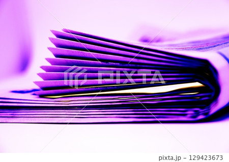 A stack of newspapers. They are ready for distribution to readers. 129423673