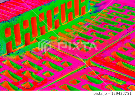 Stack of red bricks for construction, hollow brick.  129423751