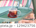 A cup of herbal tea in the country, a glass of tea on the country swing. 129423756