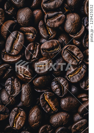 Close up of coffee beans with a brownish color Close up of coffee beans with a brownish color 129425032
