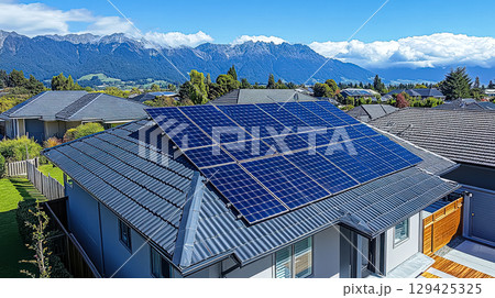 House with a solar panel on the roof House with a solar panel on the roof 129425325
