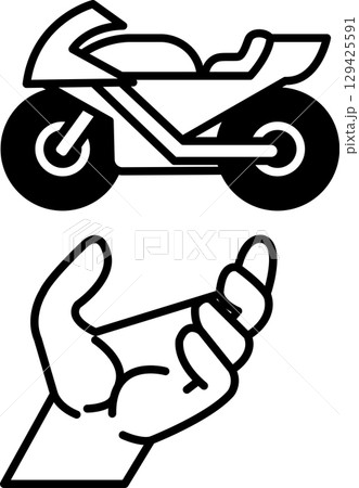 A hand is holding a motorcycle 129425591