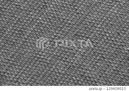 Texture of gray natural fabric with large diagonal weaving. Upholstery, cloth background 129426013