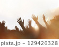 Christians passionately praising, praying, and worshipping, a background of a church gathering filled with the Holy Spirit, and a cheering crowd concept. 129426328