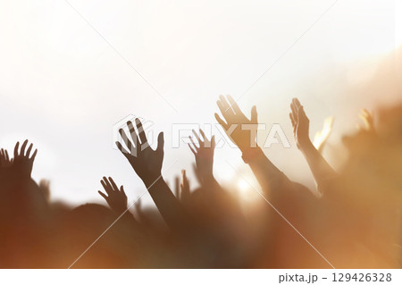 Christians passionately praising, praying, and worshipping, a background of a church gathering filled with the Holy Spirit, and a cheering crowd concept. 129426328