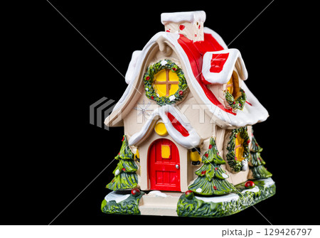 christmas house on black background 129426797