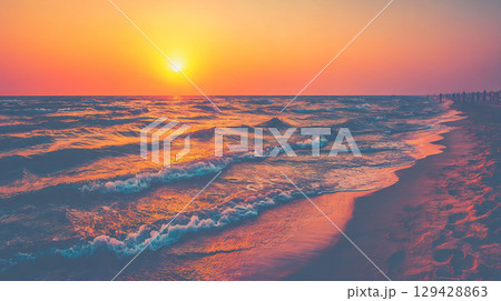 美しい夕日と波の海岸風景 129428863