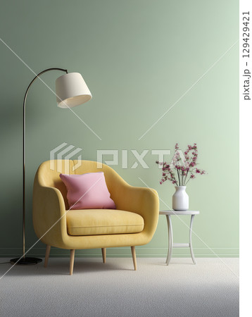 Cozy living room corner with yellow armchair, pink pillow, white side table, and tall floor lamp against soft green wall, creating calm and inviting atmosphere 129429421