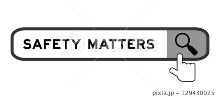 Search banner in word safety matters with hand over magnifier icon on white background 129430025