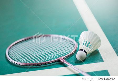 3. Shuttlecock and Racket on Badminton Court Background 129430242