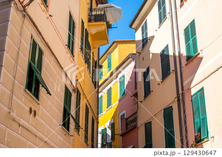 Colorful houses buildings. Monterosso Italian village. Cinque Terre narrow street architecture, Liguria, Italy. Colorful houses buildings. Monterosso Italian village. Cinque Terre narrow street architecture, Liguria, Italy. 129430647