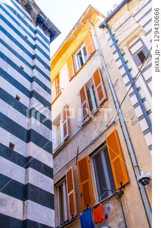 Orange Shutters on the windows. Colorful houses buildings. Monterosso Italian village. Cinque Terre narrow street architecture, Liguria, Italy. Orange Shutters on the windows. Colorful houses buildings. Monterosso Italian village. Cinque Terre narrow street architecture, Liguria, Italy. 129430666